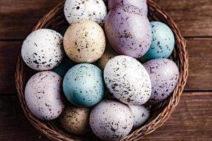 Pastel Easter eggs background. Spring greating card. Easter eggs in basket photo