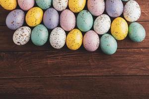 Pastel Easter eggs background. Spring greating card. Easter eggs in basket photo
