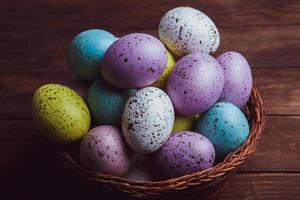 Pastel Easter eggs background. Spring greating card. Easter eggs in basket photo