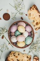 Pastel Easter eggs background. Spring greating card. Easter eggs in basket photo
