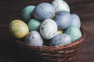Pastel Easter eggs background. Spring greating card. Easter eggs in basket photo