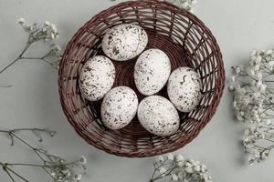 Pastel Easter eggs background. Spring greating card. Easter eggs in basket photo