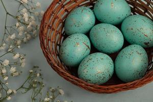 Pastel Easter eggs background. Spring greating card. Easter eggs in basket photo