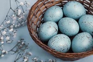 Pastel Easter eggs background. Spring greating card. Easter eggs in basket photo