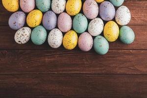 Pastel Easter eggs background. Spring greating card. Easter eggs in basket photo