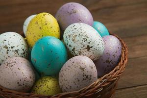 Pastel Easter eggs background. Spring greating card. Easter eggs in basket photo