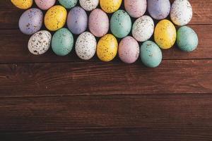 Pastel Easter eggs background. Spring greating card. Easter eggs in basket photo
