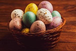 Pastel Easter eggs background. Spring greating card. Easter eggs in basket photo