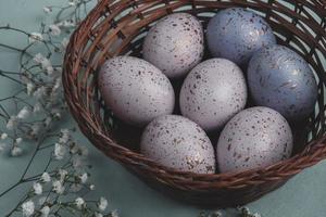Pastel Easter eggs background. Spring greating card. Easter eggs in basket photo