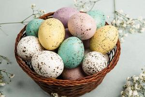 Pastel Easter eggs background. Spring greating card. Easter eggs in basket photo