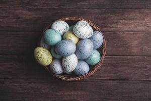 Pastel Easter eggs background. Spring greating card. Easter eggs in basket photo