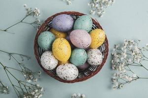 Pastel Easter eggs background. Spring greating card. Easter eggs in basket photo