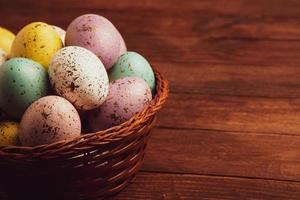 Pastel Easter eggs background. Spring greating card. Easter eggs in basket photo