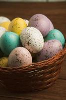 Pastel Easter eggs background. Spring greating card. Easter eggs in basket photo