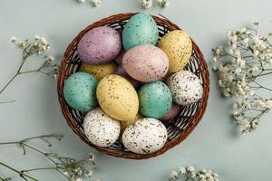 Pastel Easter eggs background. Spring greating card. Easter eggs in basket photo