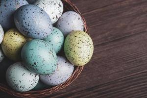 Pastel Easter eggs background. Spring greating card. Easter eggs in basket photo