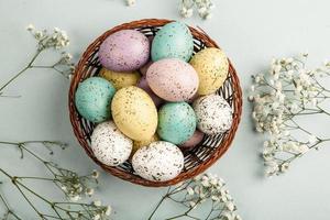 Pastel Easter eggs background. Spring greating card. Easter eggs in basket photo