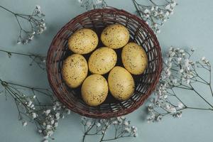 Pastel Easter eggs background. Spring greating card. Easter eggs in basket photo