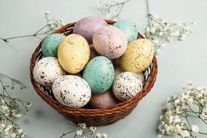 Pastel Easter eggs background. Spring greating card. Easter eggs in basket photo
