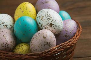 Pastel Easter eggs background. Spring greating card. Easter eggs in basket photo