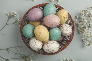 Pastel Easter eggs background. Spring greating card. Easter eggs in basket photo