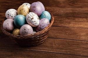 Pastel Easter eggs background. Spring greating card. Easter eggs in basket photo