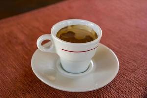 Still life with coffee cup on the table photo