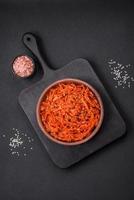 Dried squid chopped into slices and seasoned with sesame seeds and spices photo