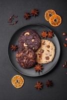 Delicious fresh crispy oatmeal cookies with chocolate and nuts photo