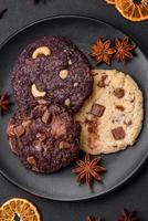 Delicious fresh crispy oatmeal cookies with chocolate and nuts photo