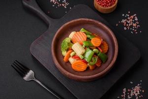 Delicious healthy vegetables steamed carrots, broccoli, asparagus beans photo