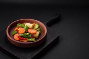 Delicious healthy vegetables steamed carrots, broccoli, asparagus beans photo