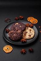 Delicious fresh crispy oatmeal cookies with chocolate and nuts photo