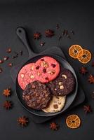 Delicious fresh crispy oatmeal cookies with chocolate and nuts photo