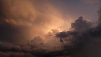 Dramatic sky. Purple and pink sky with clouds of sunset or sunrise background. Purple sky with clouds. Twilight colorful skies. Air and fluffy clouds. photo