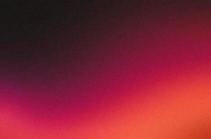 Red orange grainy gradient abstract color wave on black background, wide banner size, noise texture effect photo