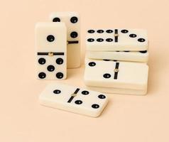 A stack of dominoes on a beige background, an intellectual game photo