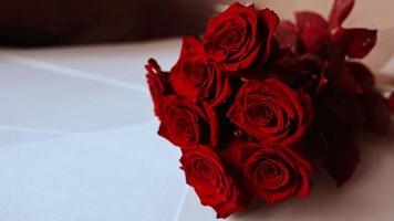 Wallpaper with red roses. Amazing background with red leaves for greeting card, invitation. Lots of red natural amazing roses. photo