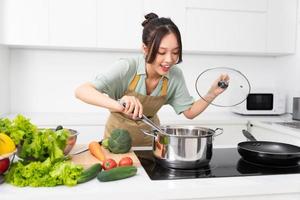 Portrait of a housewife in the kitchen at home photo