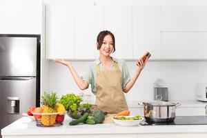 Portrait of a housewife in the kitchen at home photo