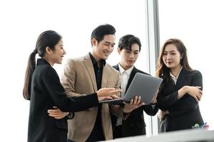 image of a group of Asian businessmen working together at the company photo