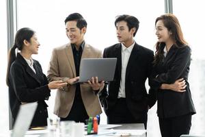 image of a group of Asian businessmen working together at the company photo