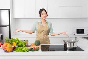 Portrait of a housewife in the kitchen at home photo