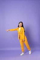 portrait of young businesswoman on purple background photo