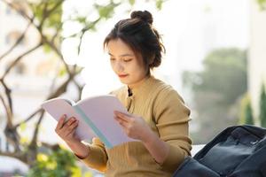 Portrait of a beautiful Asian female student at university photo