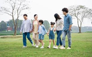Asian family photo walking together in the park