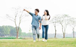 image of a happy asian couple in the park photo