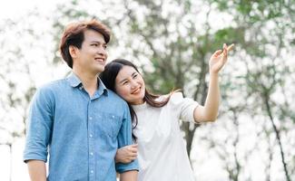 image of a happy asian couple in the park photo