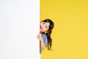 beautiful asian girl portrait, isolated on yellow background photo