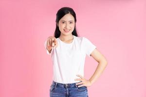 beautiful asian girl portrait, isolated on pink background photo